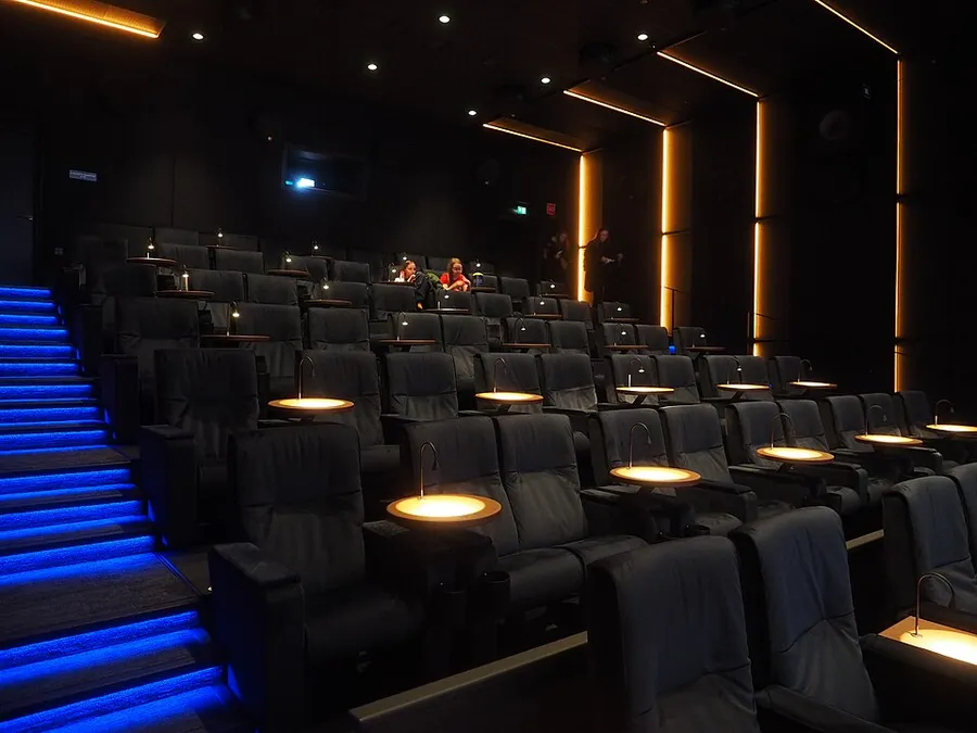 Rows of red seats in a cinema auditorium